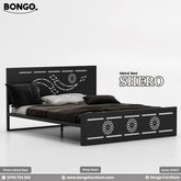 A product photo of the "SHERO Metal Bed" by Bongo Furniture. The Black bed frame has a large metal with a central laser-cut design and a footboard decorated with three matching circular, mandala-like cutouts.